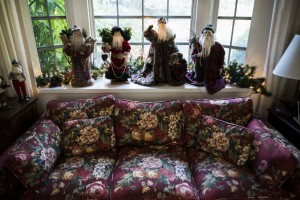 The bay window in the living room was one of the chief attractions of this home when Mary Lou (then Wingerter) Couch bought it in 1967.  Decorations in the bay window change from year to year and this year, the window is the stage for a quartet of hand-crafted artisan Santa figures.    STAFF PHOTO / NICK ADAMS