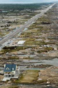 FILE - In this Sept. 14, 2008 file photo, a beachfront home stands among the debris in Gilchrist, Texas on the coast of the Gulf of Mexico after Hurricane Ike hit the area. (AP Photo/Pool, Smiley N. File Pool)