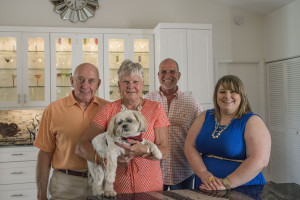 Happy with a six month renovation and modernization of their 1986 home in the Woodlands II neighborhood of Bent Tree are homeowners David and Lois Mattoon (with dog Gus) and designers from Chic on the Cheap, Mark Dalton and Jessica Napoli.     STAFF PHOTO / NICK ADAMS