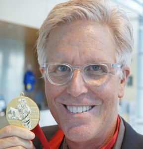 Guy Peterson with his Gold Medal from the American Institute of Architects' Florida/Caribbean chapter. Staff photo / Harold Bubil; 8-16-2016.